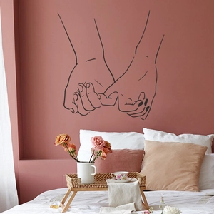 Minimalist black line art wall sticker showing pink bedroom scene with hand-holding sketch