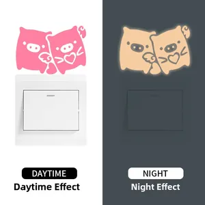 Luminous pig wall switch sticker showing daytime and night glowing effect decoration