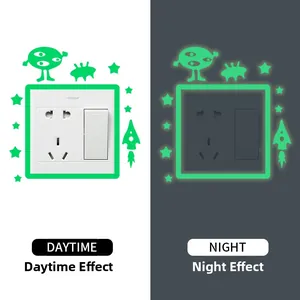 Luminous wall sticker showing daytime and night glow effect for space rocket and alien
