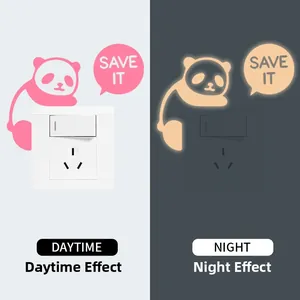 Glow-in-the-dark panda light switch sticker with save it text and daytime night comparison