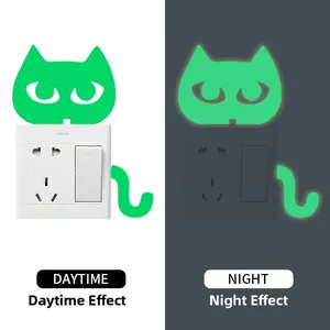 Luminous cat head light switch sticker showing daytime and night glow contrast effects