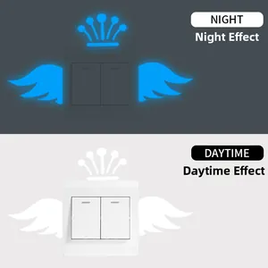Glow in the dark crown and wings switch sticker shown in day and night effect comparison