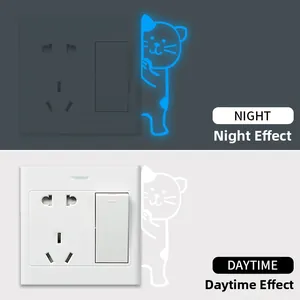 Glow-in-the-dark cat light switch sticker showing daytime and night visual effects