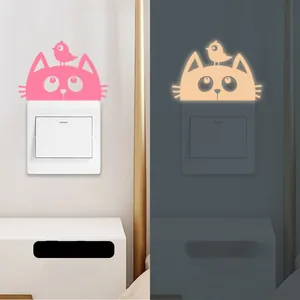 Luminous wall sticker showing cat and bird design in both daytime and glowing night view