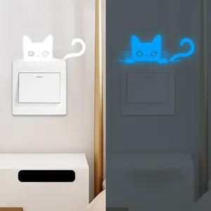 Glow-in-the-dark cat wall sticker showing blue luminous effect in daytime and night