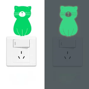 Luminous cat light switch sticker showing daytime and fluorescent night vision effect