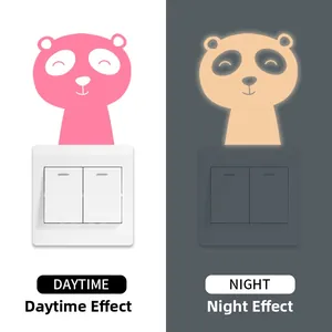 Glow-in-the-dark bear switch sticker showing daytime pink and nighttime fluorescent effects