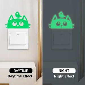 Glow-in-the-dark cat and bird switch sticker showing daytime and night visual effects
