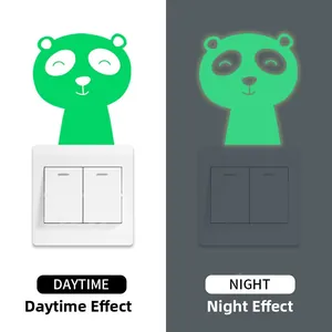 Luminous cartoon bear switch sticker showing day and night glowing effect comparison