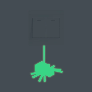 Luminous spider wall sticker for light switches made of green glowing PVC material