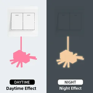 Spider wall sticker showing pink daytime color and orange glowing night effect on switch