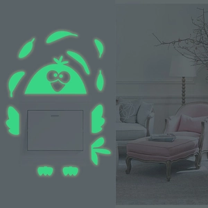 Luminous penguin and fish wall stickers showing glow-in-the-dark effect on light switches
