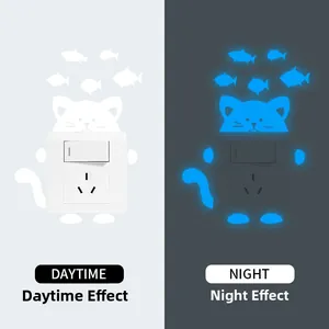 Luminous cat and fish wall stickers showing daytime and blue glowing night effect