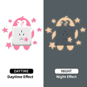 Luminous penguin and star wall stickers showing daytime and night glowing effects