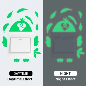 Luminous penguin switch sticker showing glow-in-the-dark vs daytime effect