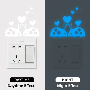 Luminous ladybug wall decals for light switches showing day and night fluorescent effects