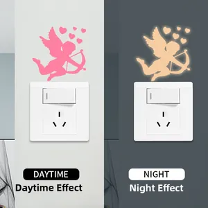 Luminous cupid and heart wall stickers showing daytime pink and night glowing effects