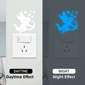 Glow in the dark Cupid wall sticker showing daytime white and night blue fluorescent effect