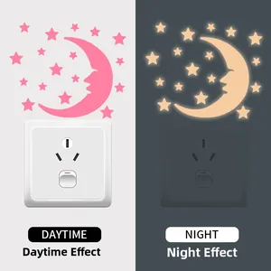 Luminous moon and stars stickers showing day and night glowing effect on wall switch