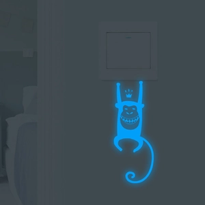 Luminous blue crown monkey wall sticker for light switch glowing in dark room