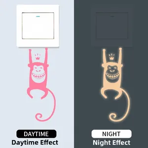 Luminous monkey crown wall sticker showing pink daytime look and green night glow effect