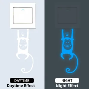 Luminous monkey wall sticker with crown showing day and night blue glow effect