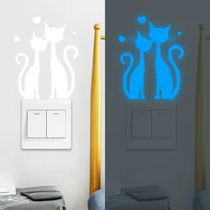 Luminous cat wall sticker showing daytime white look and blue glow effect in the dark