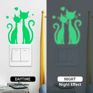 Luminous cat switch stickers showing day and night glowing effect in heart pattern