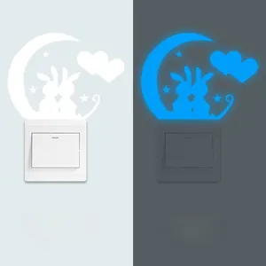 Glow-in-the-dark moon and rabbit wall switch stickers with day and night comparison