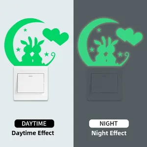 Luminous bunny and moon wall sticker showing glowing effect on light switch at night