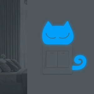 Luminous blue cat wall sticker for switch panel decoration in a dark bedroom