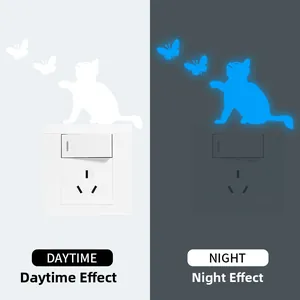 Luminous cat and butterfly wall sticker showing daytime white and night blue glow effects