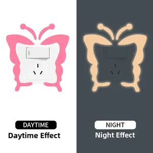 Glow-in-the-dark butterfly light switch sticker showing daytime pink and night orange glow
