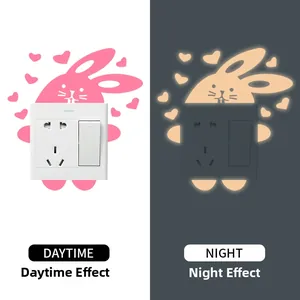 Luminous wall sticker showing daytime and night glowing effect with rabbit and heart patterns