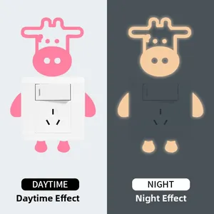 Luminous cute cow light switch sticker showing daytime and glowing night effects