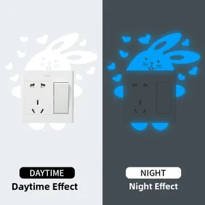Luminous bunny and heart switch sticker set showing daytime white and nighttime blue glow