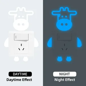 Luminous cow light switch sticker showing daytime natural look and blue night glow effect