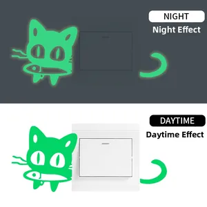Glow-in-the-dark cat and fish wall sticker showing day and night luminous effect