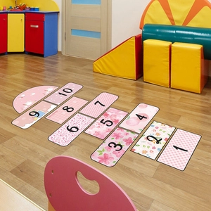 Pink floral hopscotch floor decals for kids room with cartoon patterns and numeric tiles