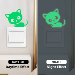 Luminous cat light switch sticker showing day and night fluorescent effect comparison