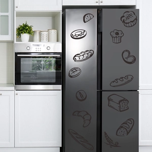 Detailed view of hand-drawn bakery wall stickers on a modern black refrigerator