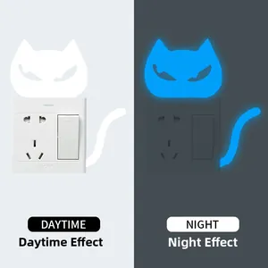 Luminous cat light switch sticker showing daytime white and night glowing blue effects
