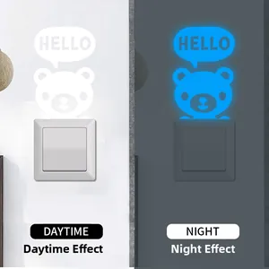 Luminous bear switch sticker showing day white and night blue fluorescent effect