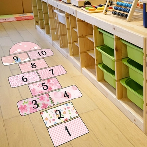 Detailed top view of pink hopscotch floor decals with floral patterns for kids' rooms