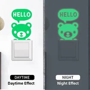 Luminous Hello Bear light switch sticker showing glow-in-the-dark effect in day and night