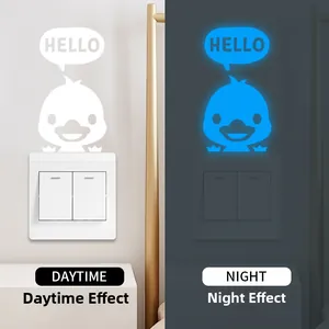 Luminous cartoon duck switch sticker with blue night glow effect on white panel