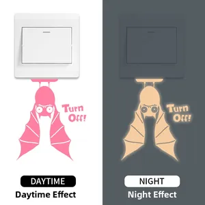 Luminous bat light switch sticker showing daytime pink vs nighttime glow comparison