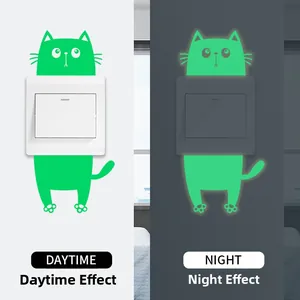 Luminous cat wall sticker showing daytime green look and nighttime glow effect on switch