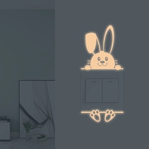 Luminous cute bunny wall sticker for light switches with warm yellow glow decoration
