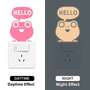 Luminous frog light switch sticker showing day and night glowing effect comparison